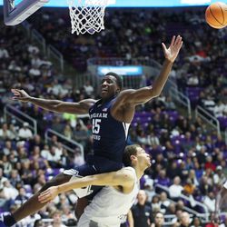 Brigham Young Cougars forward Fousseyni Traore (45) tries to grab a rebound over Weber State Wildcats forward Dyson Koehler (44) in Ogden on Saturday, Dec. 18, 2021. BYU won 89-71.