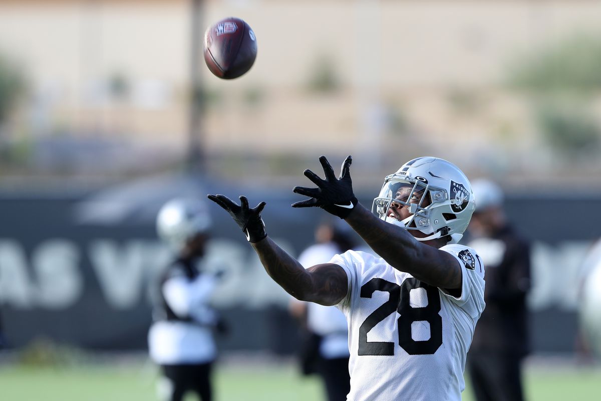 Josh Jacobs #28 of the Las Vegas Raiders catches a pass during training camp at the Las Vegas Raiders Headquarters/Intermountain Healthcare Performance Center on July 28, 2021 in Henderson, Nevada.