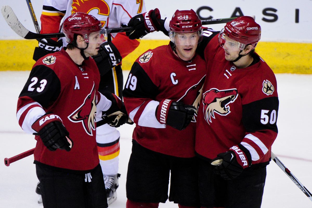 Oliver Ekman-Larsson, Shane Doan and Antoine Vermette celebrate after a goal