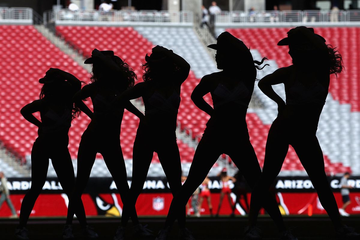 GLENDALE, AZ - NOVEMBER 06:  The Arizona Cardinal's cheerleaders warm up before the NFL game against the St. Louis Rams at the University of Phoenix Stadium on November 6, 2011 in Glendale, Arizona.  (Photo by Christian Petersen/Getty Images)