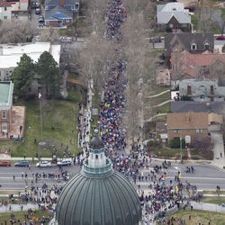 Protesters make their way up State Street to gather outside the state Capitol during the "March for Our Lives" event in Salt Lake City on Saturday, March 24, 2018.