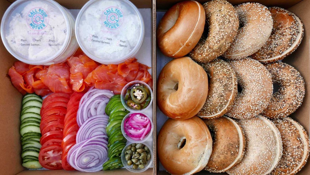 Bagels and accoutrements in a cardboard box