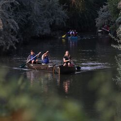 A group of students from Northwest Middle School and guides from Splore and the National Ability Center paddle canoes on the Jordan River in Salt Lake City on Thursday, Sept. 7, 2017.