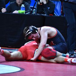 Nebraska’s Jeremiah Reno (top) wrestles Ohio State’s Malik Heinselman in the first round of the Big Ten Championships Saturday at the Pinnacle Bank Arena in Lincoln.