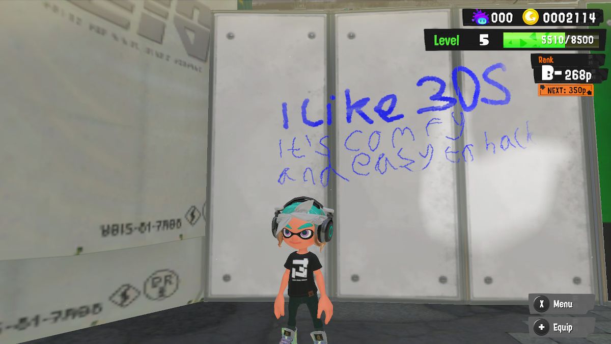 A player's post is displayed as graffiti on the wall in Splatoon 3. The post reads 