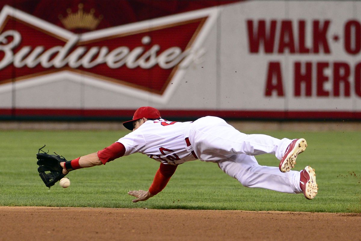 Aug 8, 2012; St. Louis, MO, USA; St. Louis Cardinals second baseman Tyler Greene (27) misses a ball against the San Francisco Giants during the second inning at Busch Stadium. Mandatory Credit: Scott Rovak-US PRESSWIRE