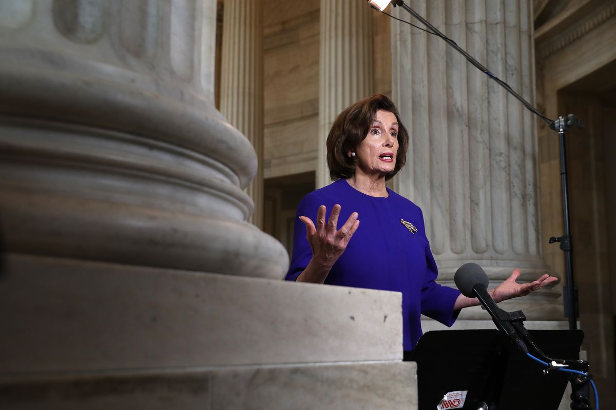 U.S. House Speaker Pelosi, wearing purple, speaks to media from Capitol Hill