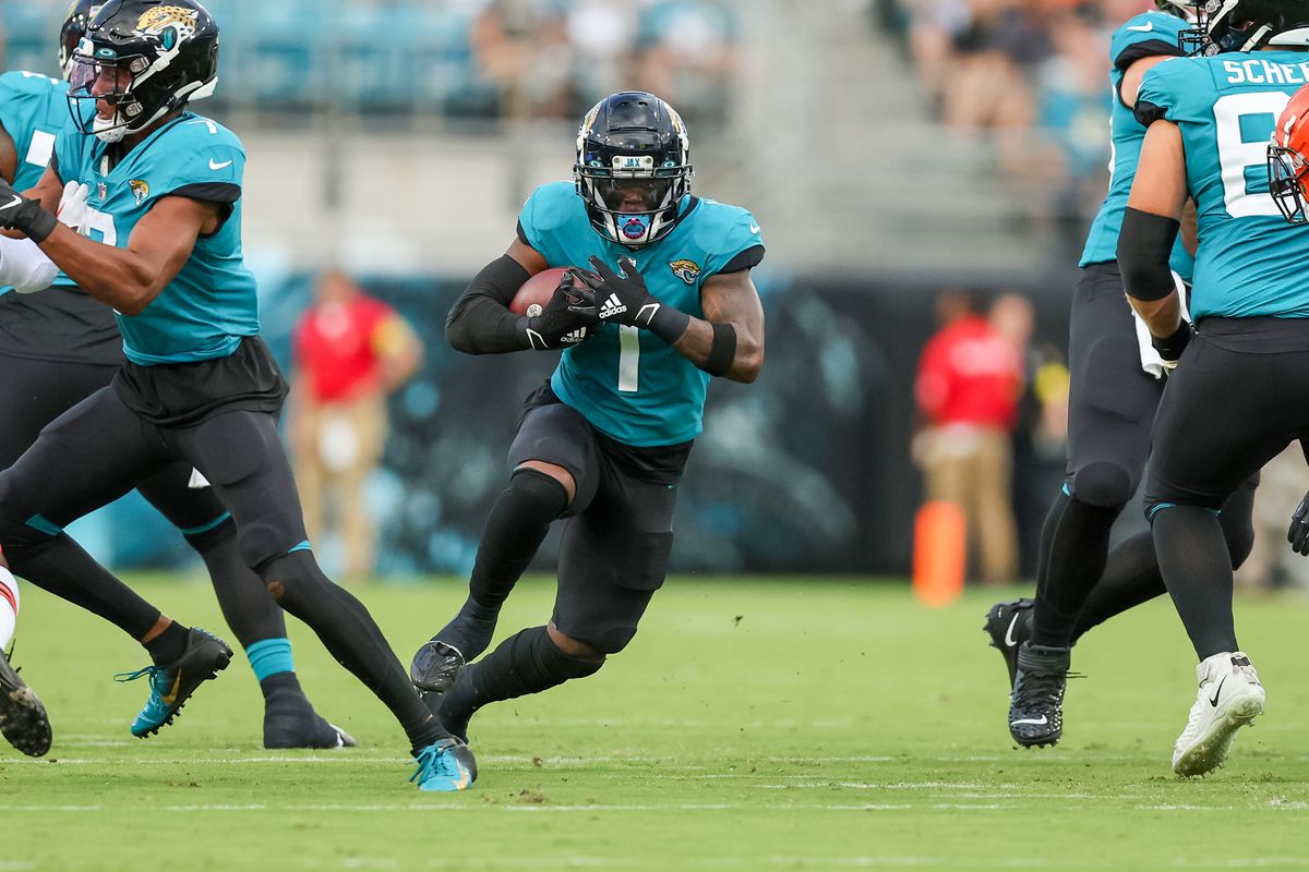 Travis Etienne Jr. #1 of the Jacksonville Jaguars runs against the Cleveland Browns during a football game at TIAA Bank Field on August 12, 2022 in Jacksonville, Florida.