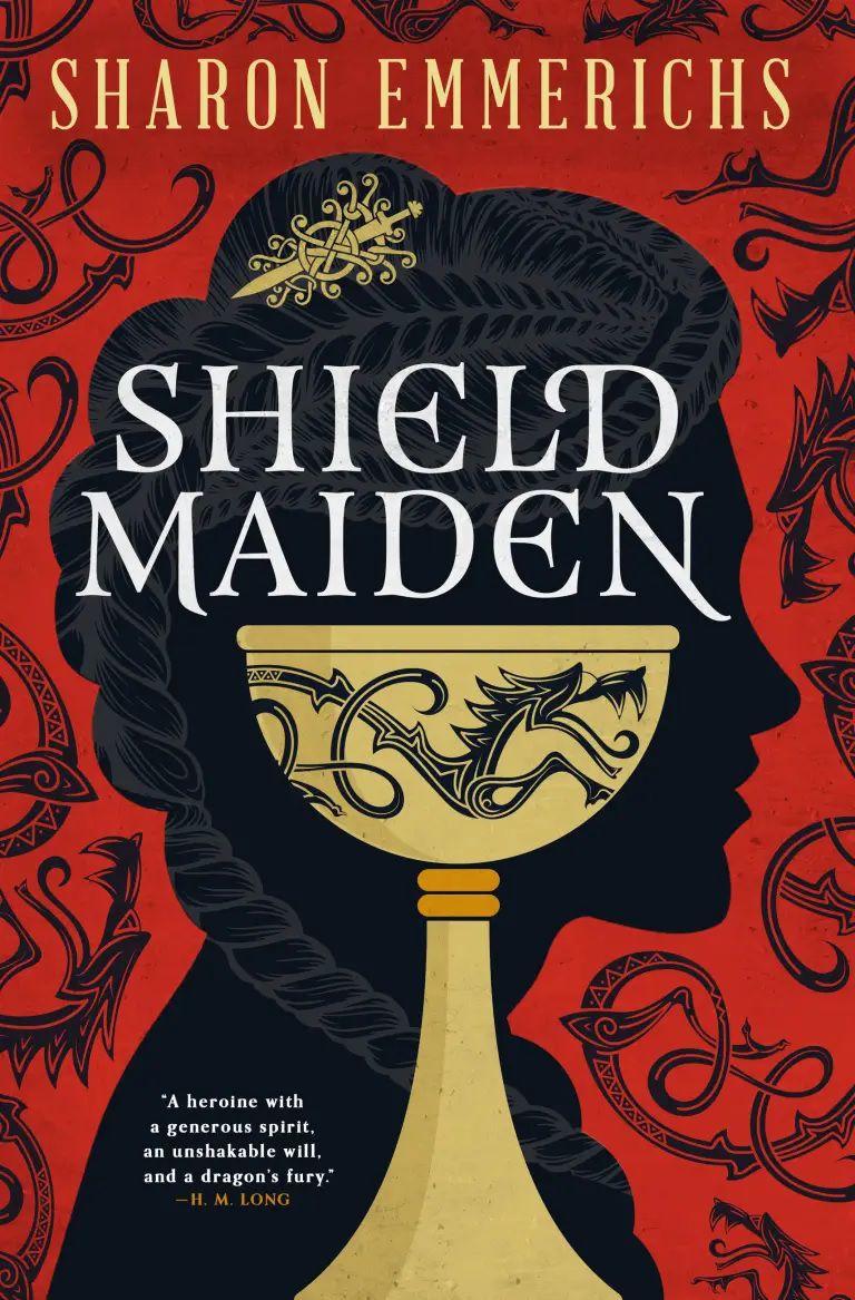 Cover image for Sharon Emmerichs’ Shield Maiden, featuring an ornate cup in front of a black silhouette of a woman’s face, against a red background with dragons on it.