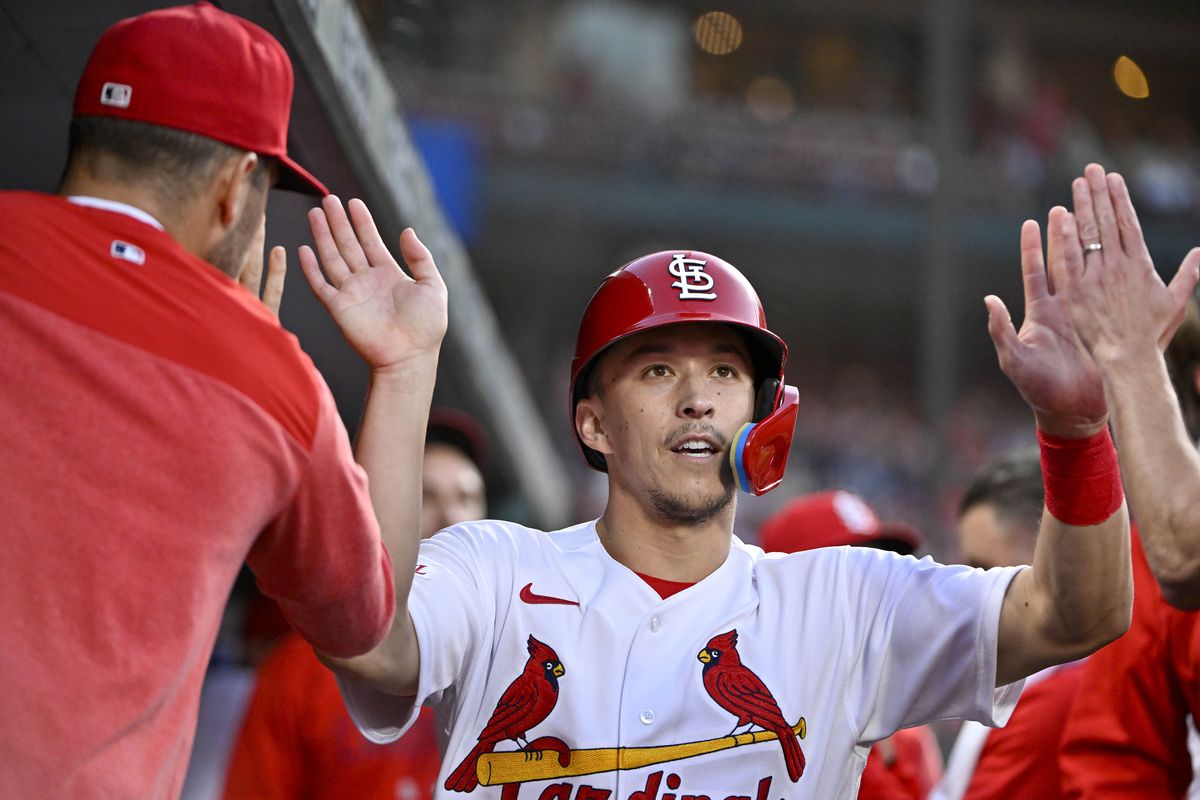 St. Louis Cardinals right fielder Tommy Edman is congratulated by teammates after scoring against the Milwaukee Brewers during the fourth inning at Busch Stadium.&nbsp;