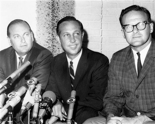 The NFL holds a press conference to announce that the NFL and AFL plan to merge in an expanded major professional football league. Pete Rozelle, named Commissioner of the newly merged NFL, is center. At left is Tex Schramm, President of the NFL Dallas Cowboys. Lamar Hunt, President of the AFL Kansas City Chiefs, is right, in New York on June 8, 1966. (Pro Football Hall of Fame via AP Images)