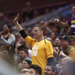 Utah Jazz fans celebrate Utah Jazz guard Donovan Mitchell (45) scoring on the Minnesota Timberwolves at Vivint Arena in Salt Lake City on Thursday, March 14, 2019.