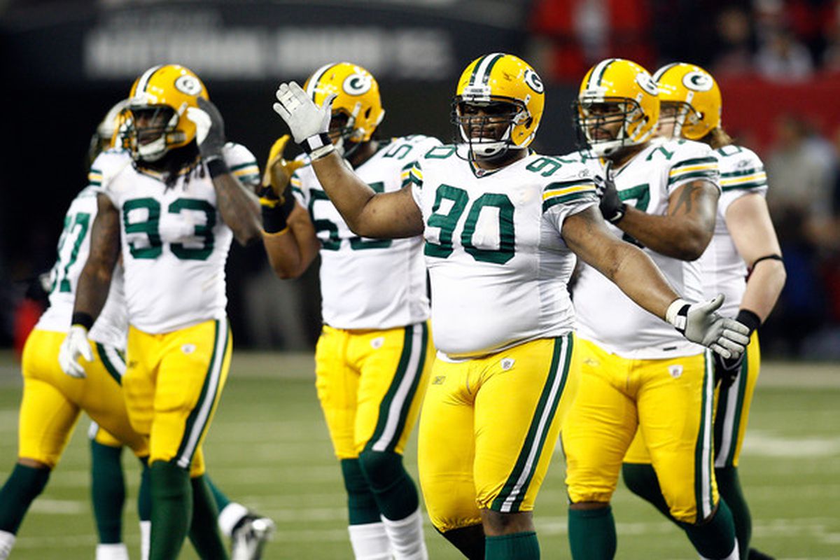 B.J. Raji (90) of the Green Bay Packers celebrates a defensive stop against the Atlanta Falcons during their 2011 NFC divisional playoff game on January 15 2011
