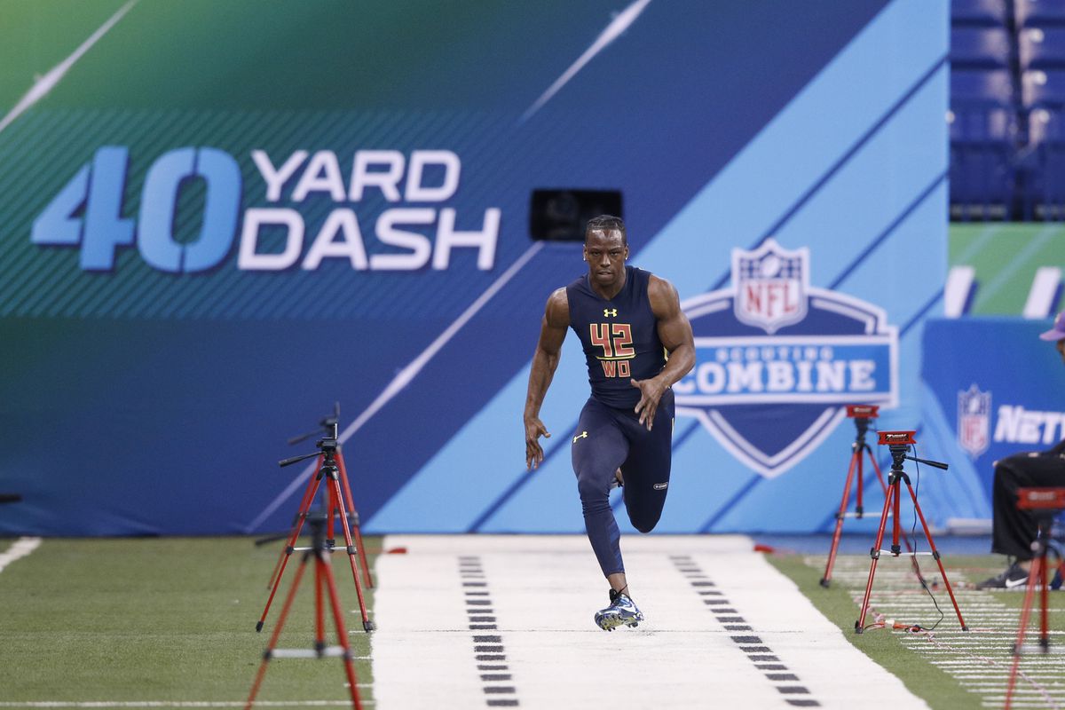 Wide receiver John Ross of Washington runs the 40-yard dash in an unofficial record time of 4.22 seconds during day four of the NFL Combine at Lucas Oil Stadium on March 4, 2017 in Indianapolis, Indiana.