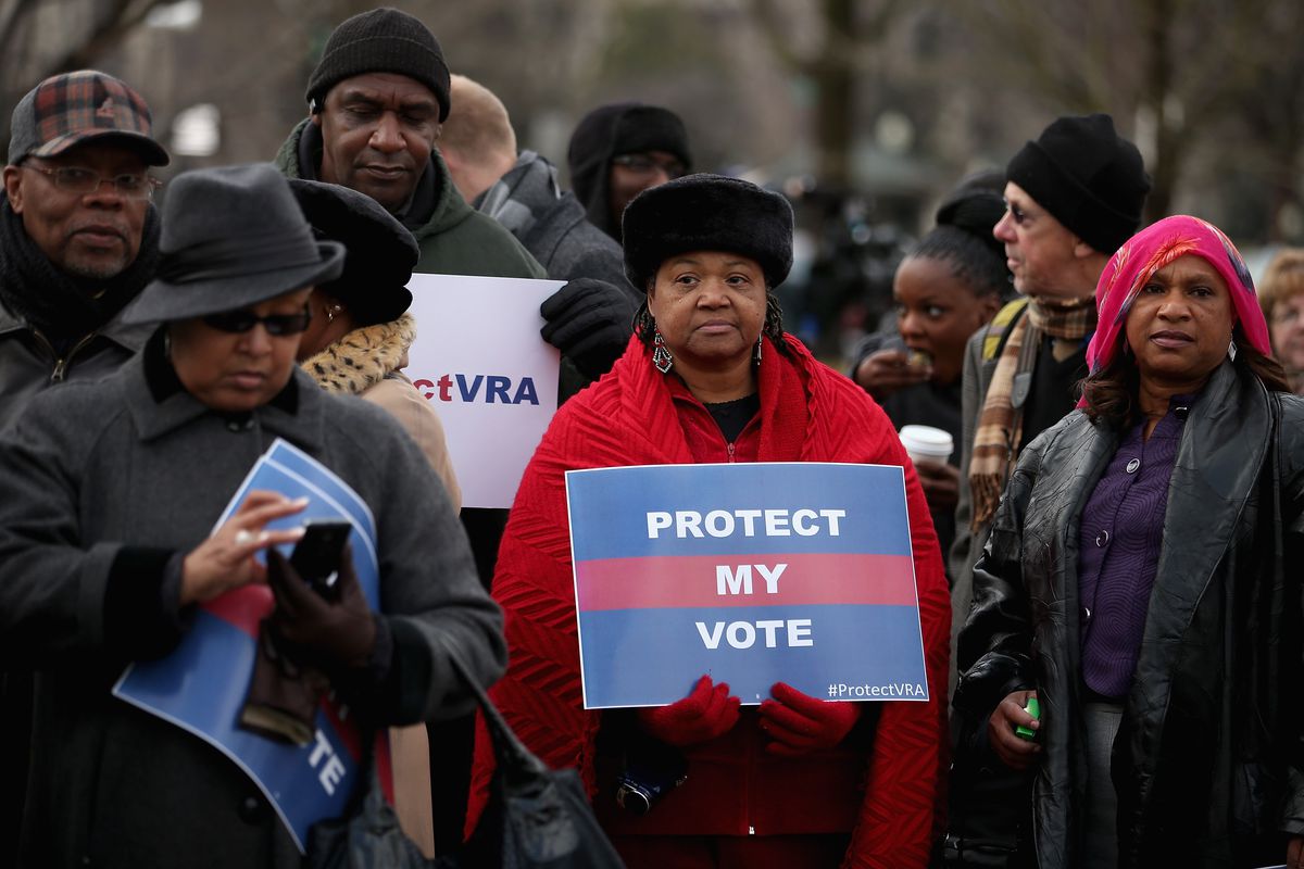 A group of Alabama residents stand outside of the Supreme Court’s oral arguments in Shelby County v. Holder on February 27, 2013. 
