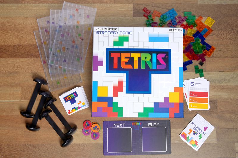 The contents of the Tetris strategy board game laid out on the table.