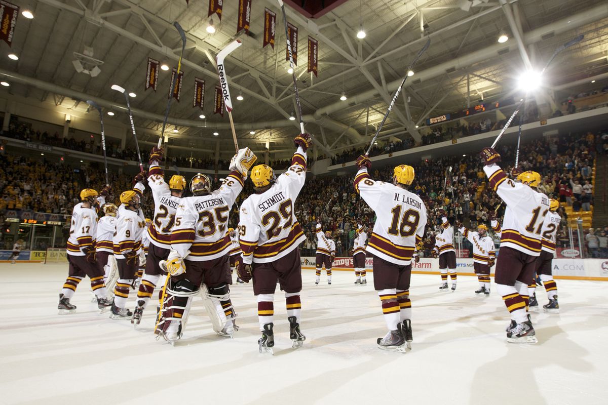 University of Minnesota players saluting their fans following a sweep