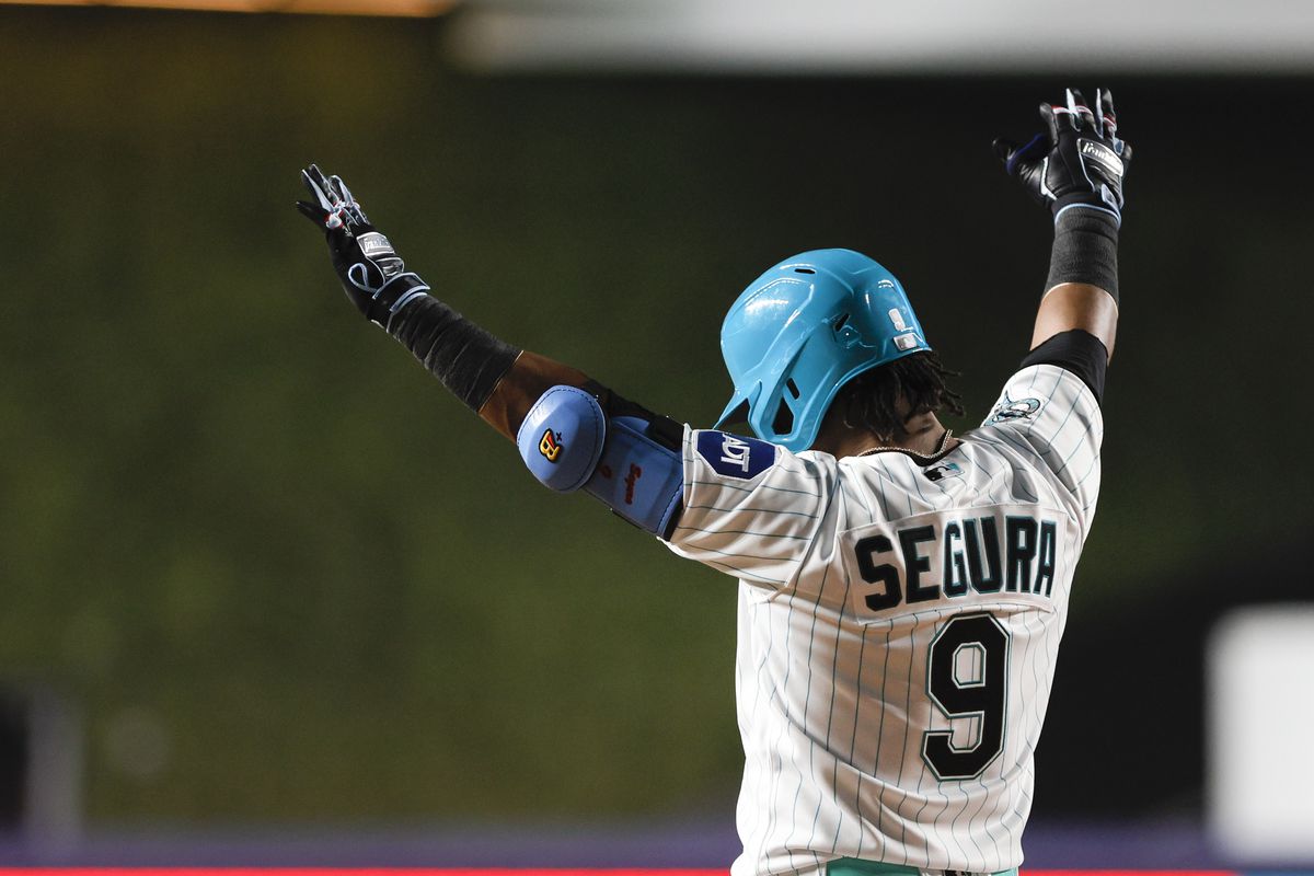 Miami Marlins third baseman Jean Segura (9) celebrates after hitting a walk-off single during the ninth inning against the Chicago Cubs at loanDepot Park.
