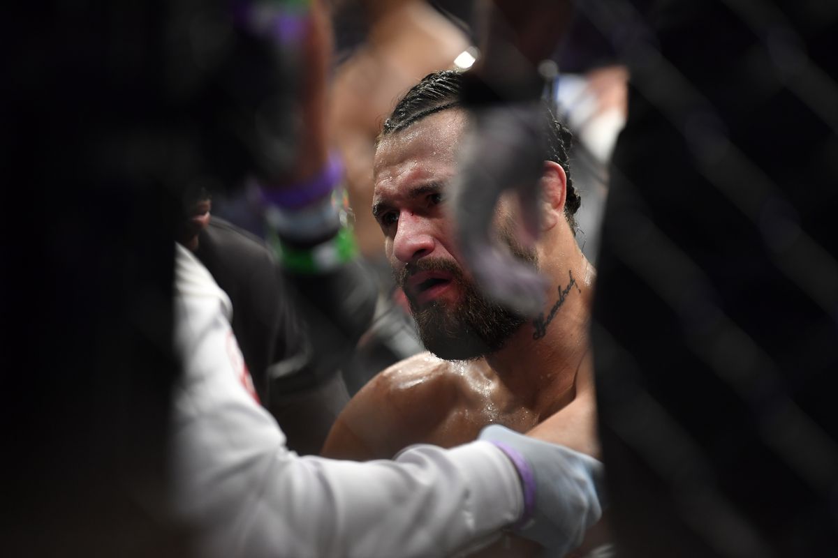 Jorge Masvidal sits on the stool right after his knockout loss to Kamaru Usman at UFC 261. 