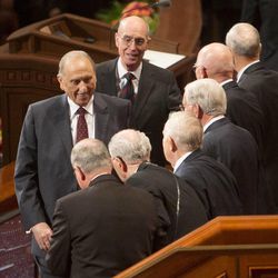 President Thomas S Monson and President Henry B Eyring shake hands with members of the Twelve as they exit the stand Saturday morning session of the 183rd Semiannual General Conference for the Church of Jesus Christ of Latter-day Saints Saturday, Oct. 5, 2013 inside the Conference Center.