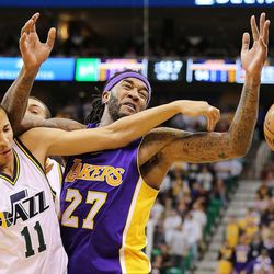 Utah Jazz guard Dante Exum (11) knocks the inbounds pass away from Los Angeles Lakers center Jordan Hill (27) as the Jazz and the Lakers play Wednesday, Feb. 25, 2015, at EnergySolutions Arena in Salt Lake City.