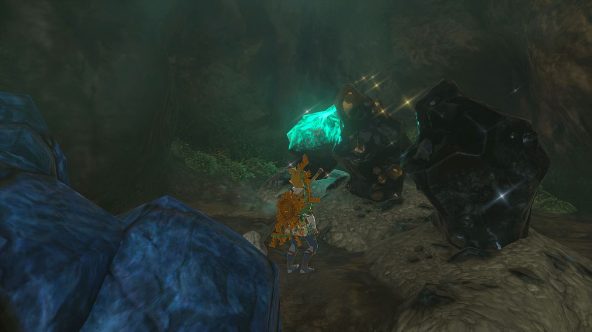 Link in Tears of the Kingdom stands in front of various types of ore deposits: one with glowing blue luminous stone, one with yellow sparkles, and a plain black one