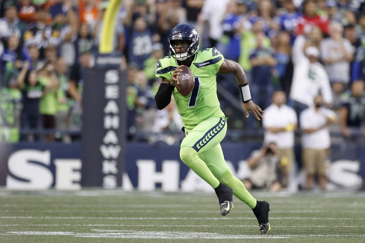 Geno Smith #7 of the Seattle Seahawks carries the ball during the third quarter against the Denver Broncos at Lumen Field on September 12, 2022 in Seattle, Washington.
