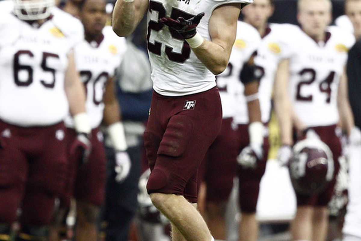 HOUSTON - DECEMBER 31:  Wide receiver Ryan Swope #25 of Texas A&M completes  a reception against Nortwestern University at Reliant Stadium on December 31, 2011 in Houston, Texas.  (Photo by Bob Levey/Getty Images)