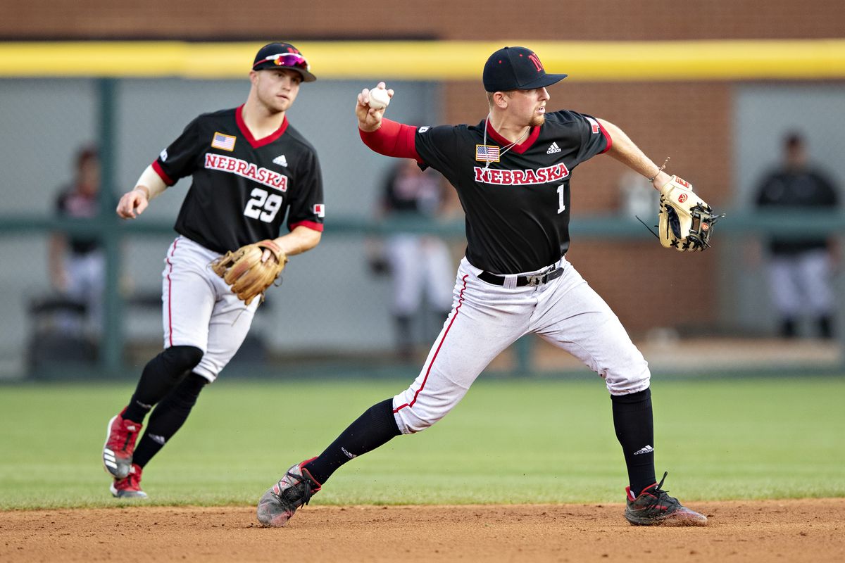 Spencer Schwellenbach of the Nebraska Cornhuskers throws out a runner at first base during a game against the Arkansas Razorbacks at the NCAA Fayetteville Regional at Baum-Walker Stadium at George Cole Field on June 7, 2021 in Fayetteville, Arkansas.