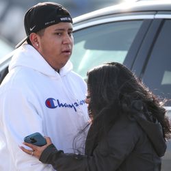 Chris Salazar, who works at Fashion Place Mall, hugs his mother, Evelyn Salazar Atwood, who rushed to the scene after a shooting at the mall in Murray on Sunday, Jan. 13, 2019.