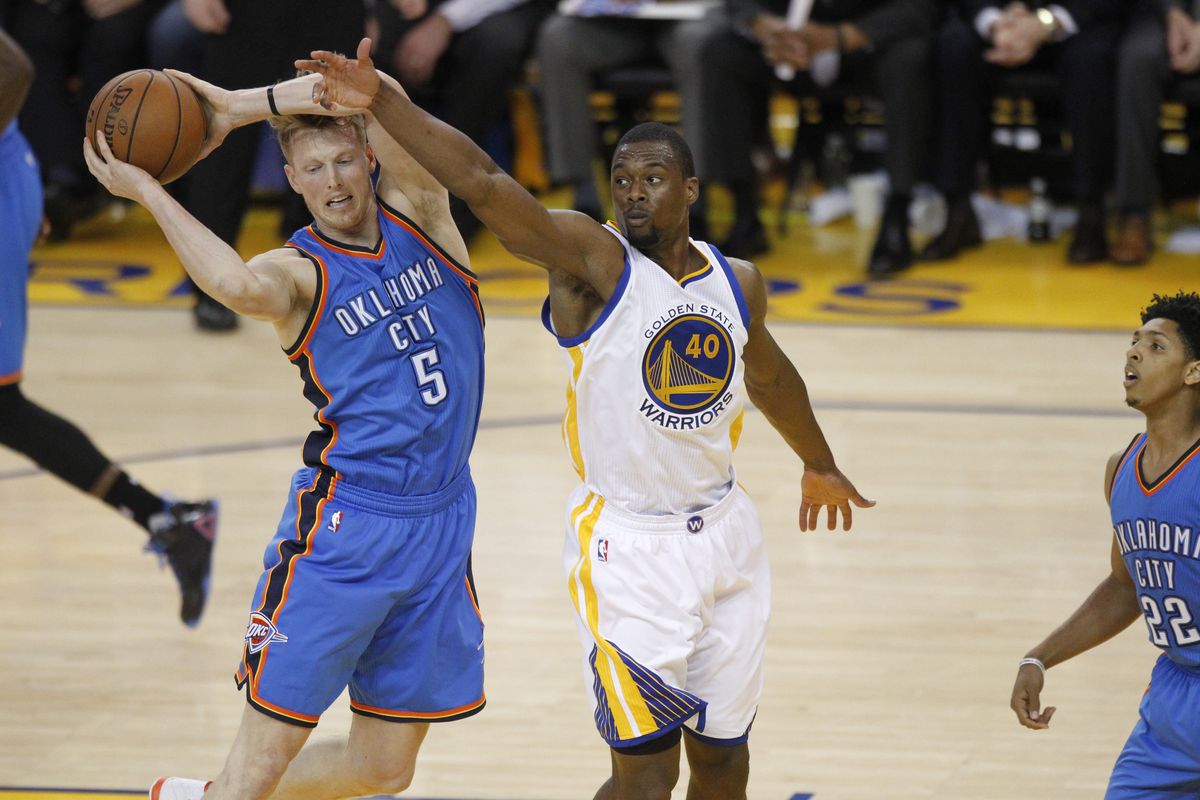 May 18, 2016; Oakland, CA, USA; Oklahoma City Thunder forward Kyle Singler (5) holds onto a rebound next to Golden State Warriors forward Harrison Barnes (40) in the fourth quarter in game two of the Western conference finals of the NBA Playoffs.