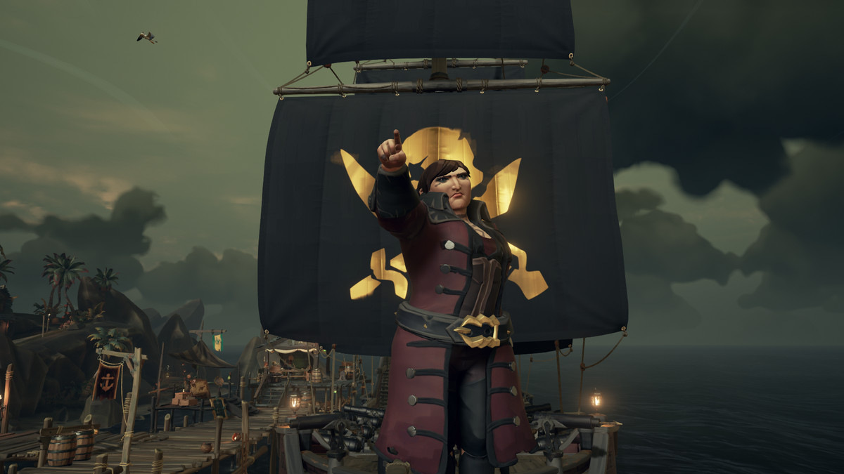 Image: Sea of Thieves - a player poses next to their skull sails