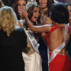 Miss Connecticut Erin Brady, center, reacts after winning the Miss USA 2013 pageant, Sunday, June 16, 2013, in Las Vegas. (AP Photo/Jeff Bottari)