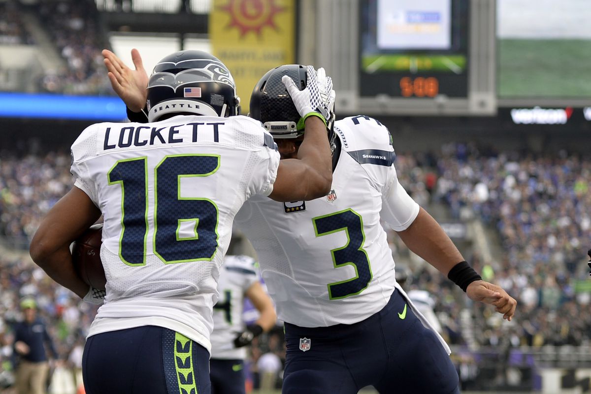 Seattle Seahawks wide receiver Tyler Lockett celebrates with quarterback Russell Wilson after scoring a touchdown during the during the first quarter against the Baltimore Ravens at M&amp;T Bank Stadium.