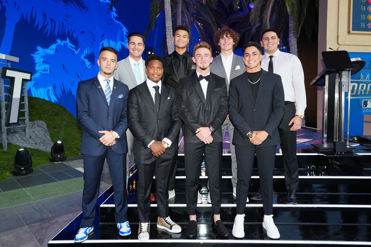 Eight amateur players pose for a photo during the 2022 Major League Baseball Draft at L.A. Live on Sunday, July 17, 2022 in Los Angeles, California.
