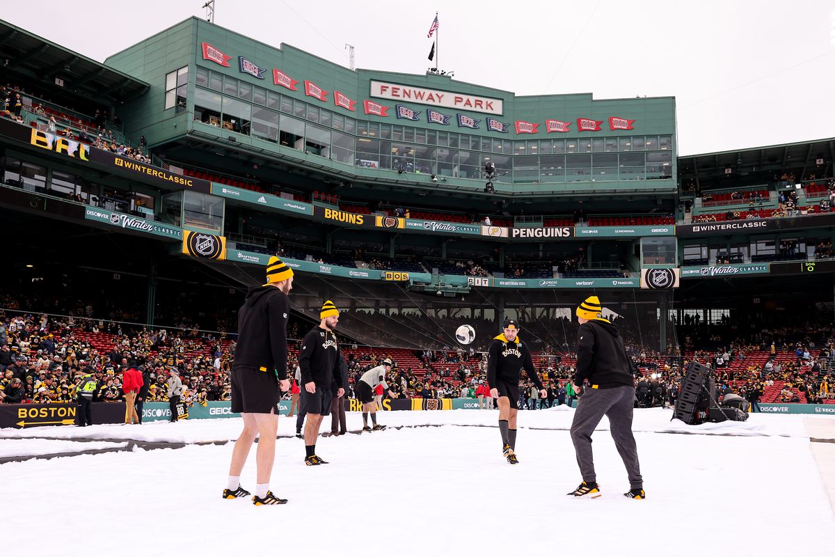 Boston Bruins players warm up with a soccer ball prior to playing the Pittsburgh Penguins in the 2023 Discover NHL Winter Classic at Fenway Park on January 02, 2023 in Boston, Massachusetts.