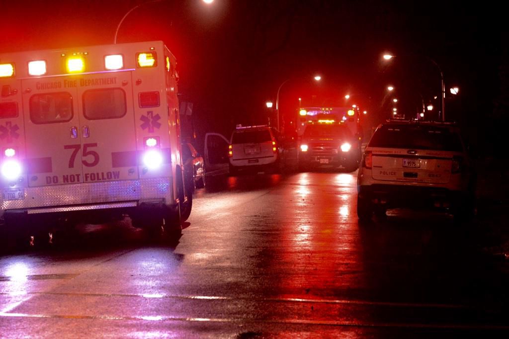 Ambulances transport some of the five shooting victims on Monday night after an incident in Englewood. | Brian Jackson / Sun-Times