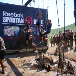 Competitors take part Saturday, June 29, 2013, in the Spartan Race at Soldier Hollow.