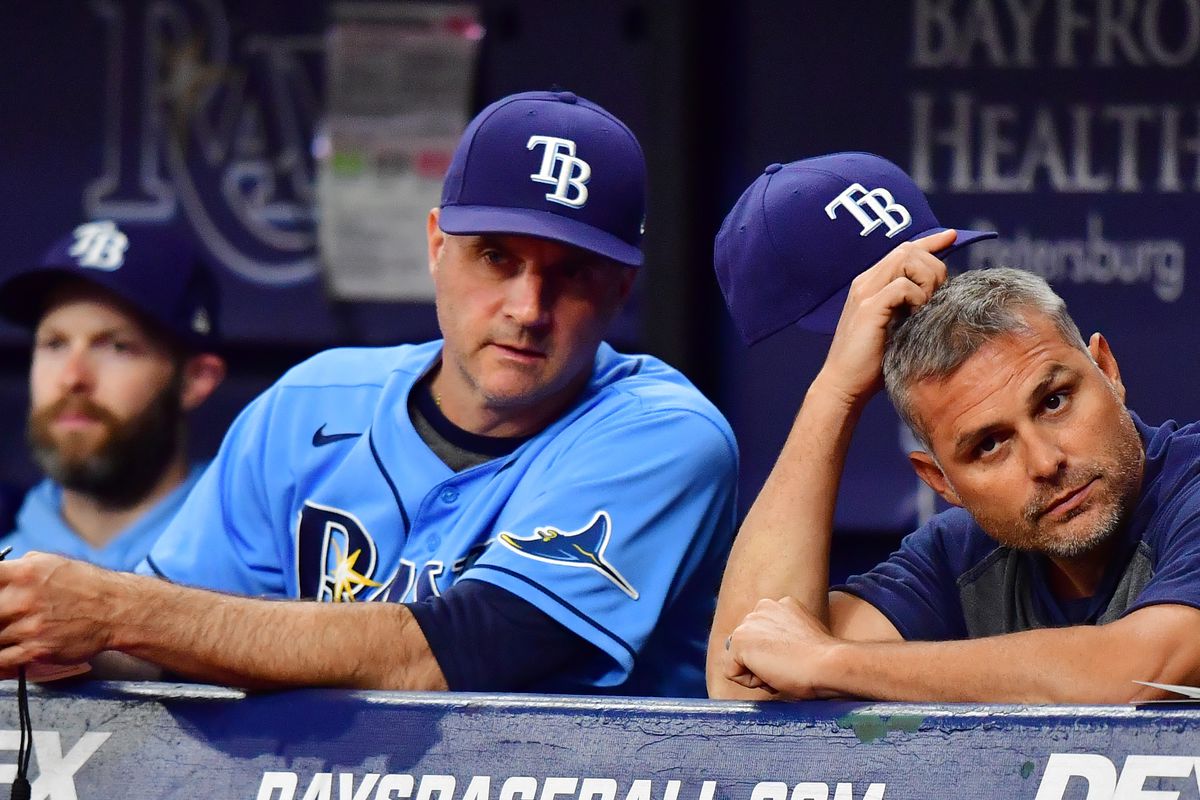 Manager Kevin Cash #16 (right) of the Tampa Bay Rays looks on with Matt Quatraro #33 during a game against the Baltimore Orioles at Tropicana Field on July 19, 2021 in St Petersburg, Florida.  &nbsp;   