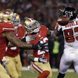 San Francisco 49ers linebacker NaVorro Bowman (53) intercepts a pass intended for Atlanta Falcons wide receiver Harry Douglas (83), before making an 89-yard touchdown run in the second half of an NFL football game in San Francisco, Monday, Dec. 23, 2013. (AP Photo/Marcio Jose Sanchez)