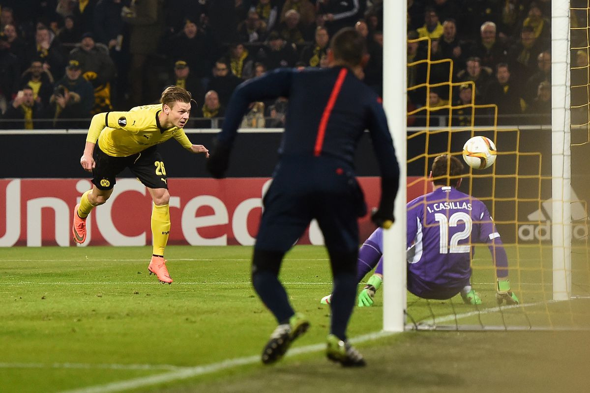 Lukasz Piszczek heads home the rebound to put Dortmund in the lead