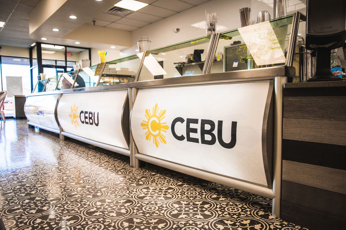 A close-up of a white counter that reads “C Cebu”