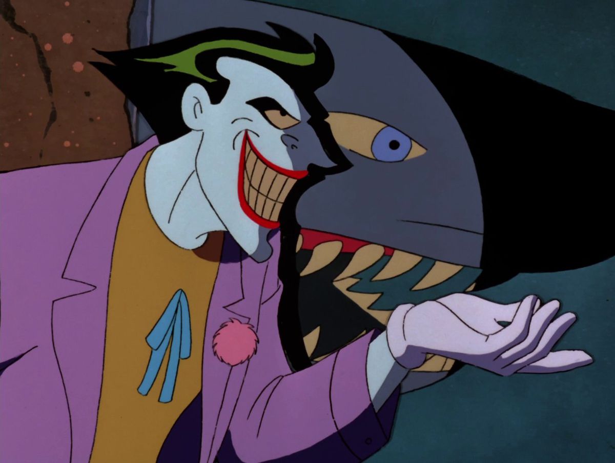 Joker standing beside a shark in a tank in “The Laughing Fish” from Batman: The Animated Series
