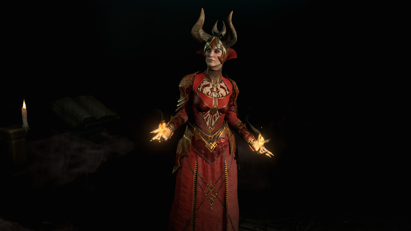 Sorcerer standing in the dark with fire illuminating her hands in Diablo 4