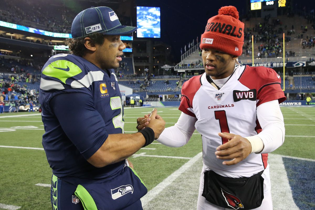 Russell Wilson of the Seattle Seahawks and Kyler Murray of the Arizona Cardinals shake hands after the Arizona Cardinals defeated the Seattle Seahawks 27-13 during their game at CenturyLink Field on December 22, 2019 in Seattle, Washington.