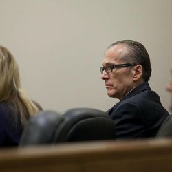 Martin MacNeill sits with his defense counsel during testimony at his trial at 4th District Court in Provo Wednesday, Nov. 6, 2013. MacNeill is charged with murder for allegedly killing his wife, Michele MacNeill, in 2007.