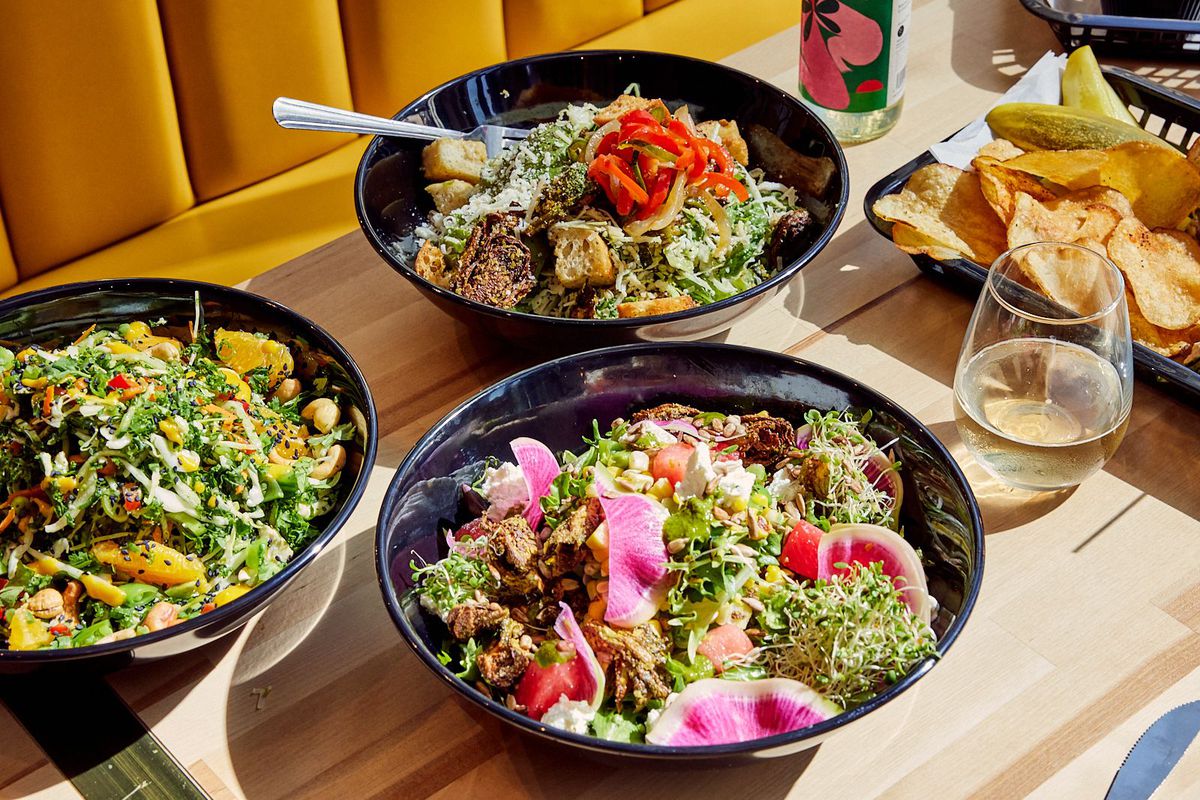 An array of salads in bowls.