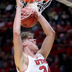 Utah Utes forward Jayce Johnson (34) dunks the ball during a men's basketball game against the LSU Tigers at the Huntsman Center in Salt Lake City on Monday, March 19, 2018. Utah won 95-71.
