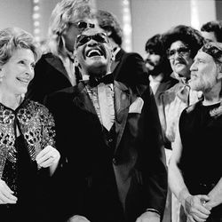 FILE - In this March 16, 1983, file photo, first lady Nancy Reagan, left, gets a laugh with Ray Charles, center, and Willie Nelson, right, and other entertainers at a salute to country music at Constitution Hall in Washington. The former first lady has died at 94, The Associated Press confirmed Sunday, March 6, 2016.