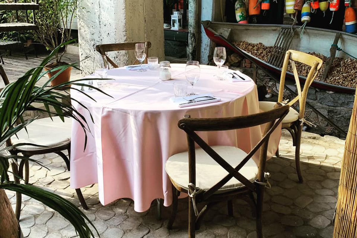 inside of restaurant with pink table cloth